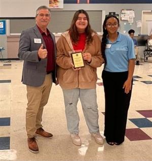 Mia receiving the award